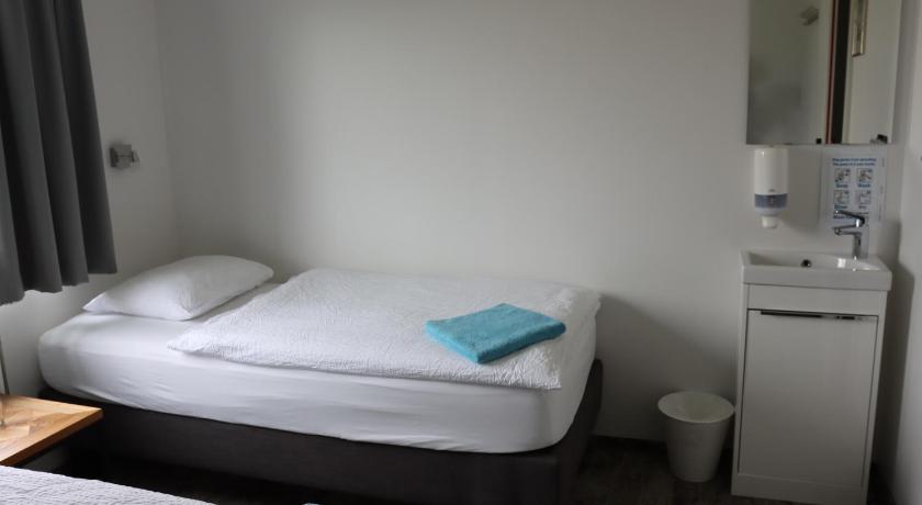 Image of Economy Triple Room with Shared Bathroom 0
