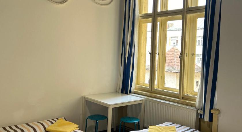 Image of Basic Triple Room with Shared Bathroom 0