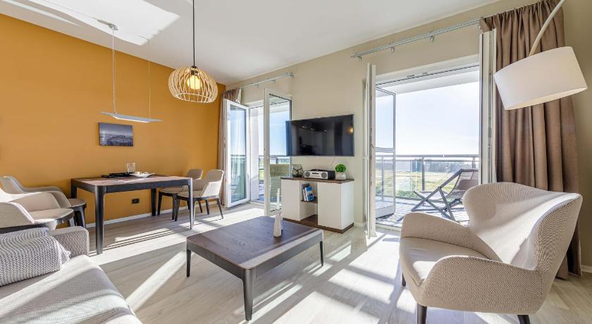 Dünenlounge - 5 Sterne Ferienwohnung mit West-Balkon und fantastischem Blick über den Deich