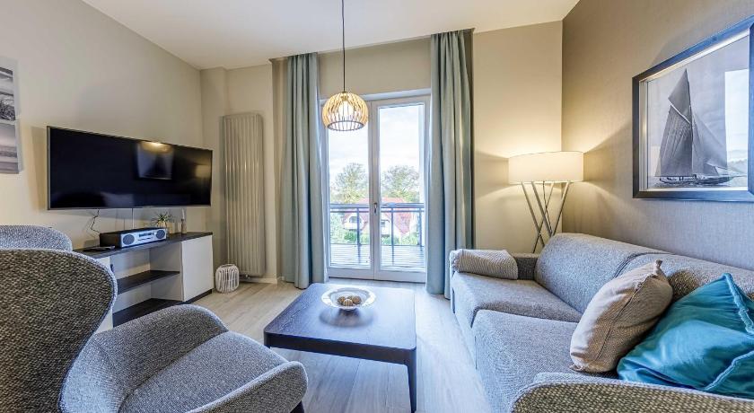 Boddenzeit - Moderne Ferienwohnung mit Nordbalkon, Wellnessbereich und Nähe zum Ostseestrand