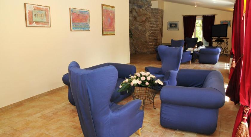 a living room filled with couches and chairs, Villa Irlanda Grand Hotel in Gaeta