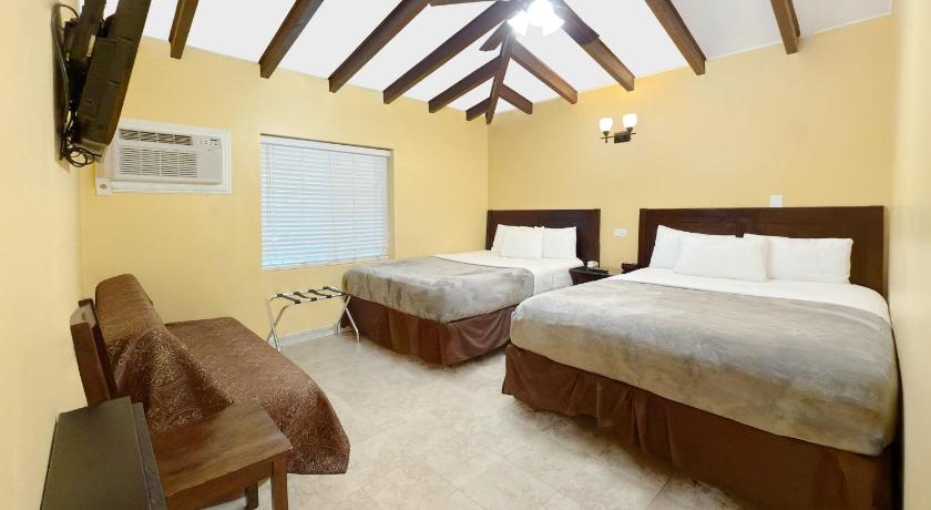 Image of Standard Two Queen Beds Plus Sofabed 1