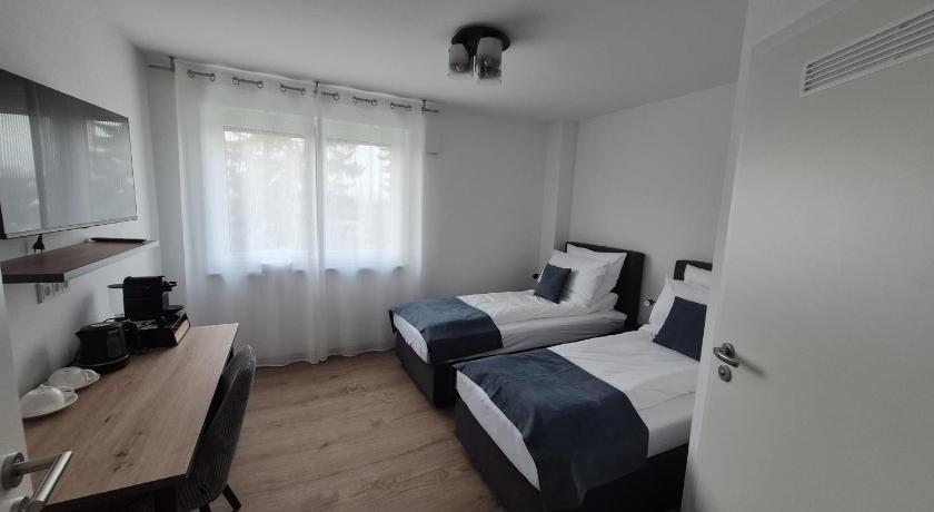 Apartments Seibel Doppel-Zweibettzimmer mit Bad