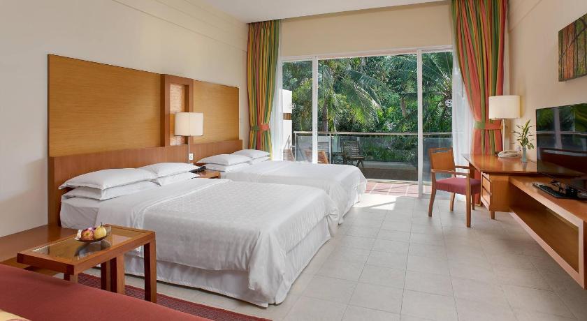 Image of guest room, 2 double, sofa bed, garden view, balcony 0