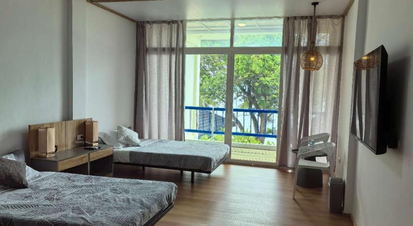 รูปของห้องเตียงใหญ่หรือเตียงแฝดพร้อมวิวด้านข้างของทะเล (Double or Twin Room with Side Sea View) 0
