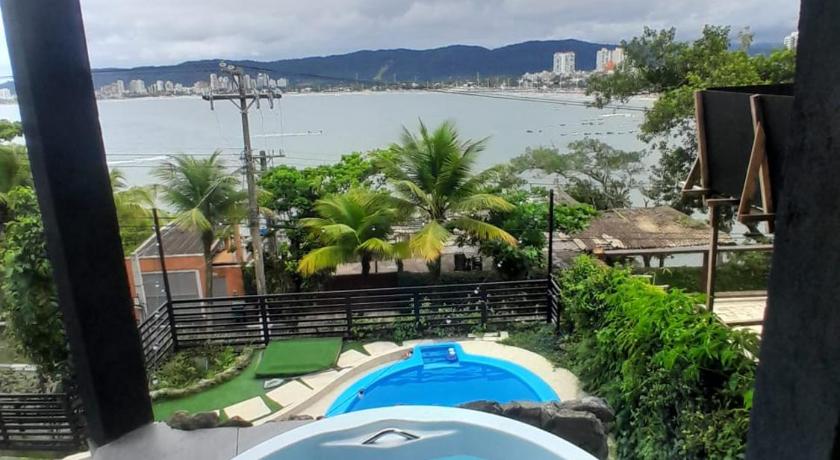 Guarujá Casamar paraiso na praia com a vista do mar dos sonhos piscina e spa 4-Star Guesthouse room