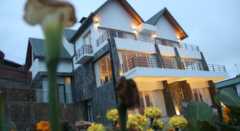 a house with a bunch of flowers in front of it, Serenus Boutique Villa in Nuwara Eliya