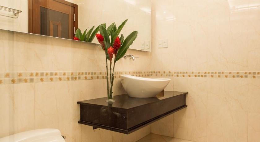 a bathroom with a toilet and a sink, Valentine Hotel in Ho Chi Minh City