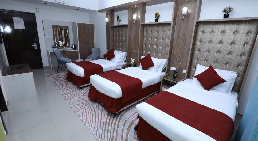 Image of Deluxe Triple Room with Balcony 0