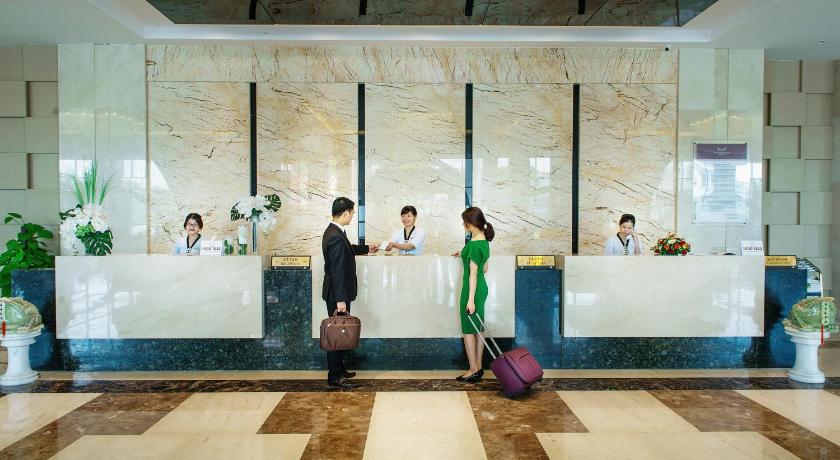 people are standing in a lobby of a hotel, Muong Thanh Grand Quang Nam in Tam Ky (Quang Nam)