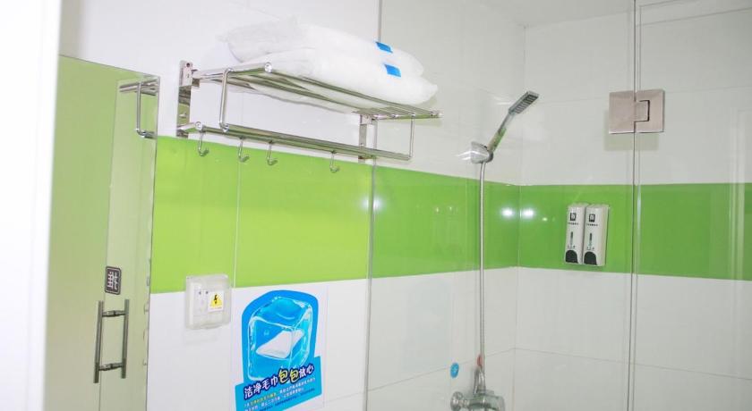 a bathroom with a towel rack and a shower curtain, 7 Days Inn Wuhan Jianghan Road Jiqing Street Branch in Wuhan
