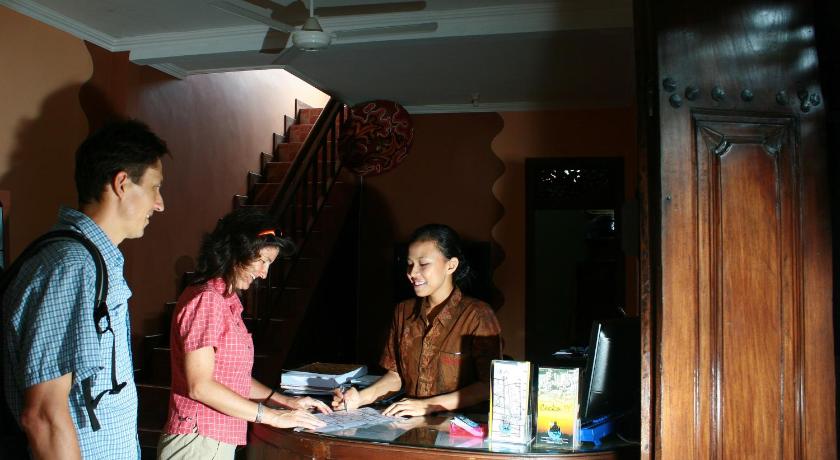 people standing around a table, Hotel 1001 Malam in Yogyakarta