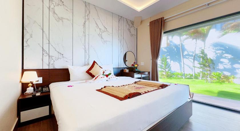 Ảnh của Phòng Deluxe Giường Đôi Nhìn Ra Biển Từ Phía Bên Cạnh (Deluxe Double Room with Side Sea View) 4