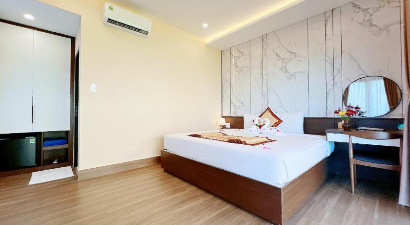 Ảnh của Phòng Deluxe Giường Đôi Nhìn Ra Biển Từ Phía Bên Cạnh (Deluxe Double Room with Side Sea View) 9