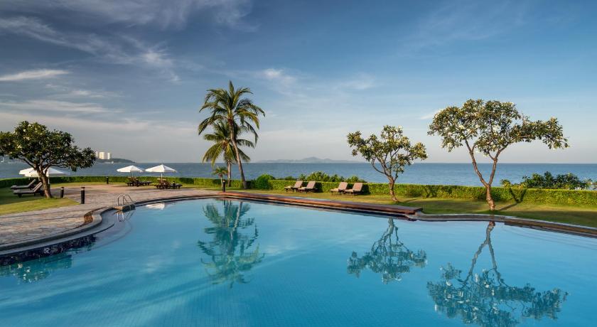 a large pool of water in front of a beach, Dusit Thani Pattaya (SHA Extra Plus) in Pattaya