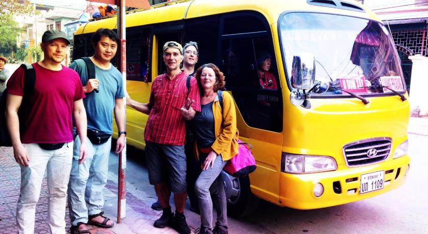 people standing next to a yellow bus, Hong Ky Boutique Hotel in Dien Bien Phu
