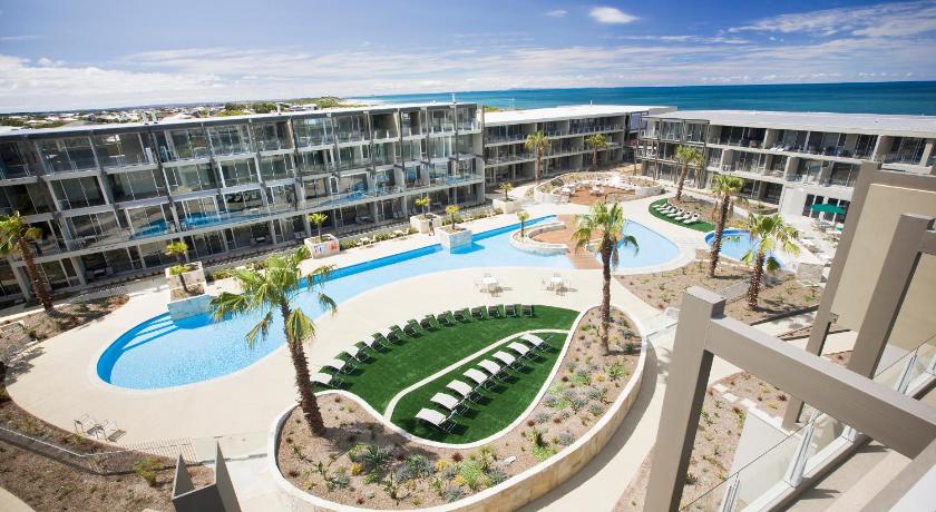 a large swimming pool with a balcony overlooking the ocean, Wyndham Resort Torquay in Great Ocean Road - Torquay