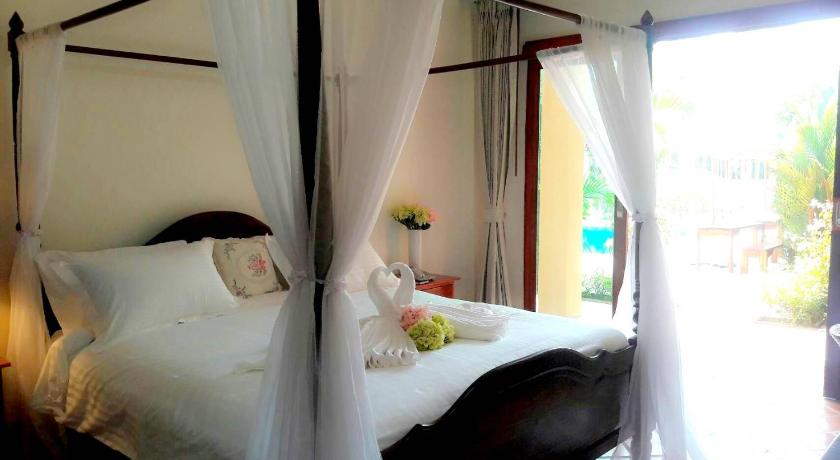Bild av Deluxerum med King size-säng och utsikt mot pool (Deluxe Pool View King Bed) 4