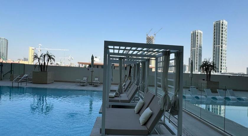 Luxurious Belvilla 1BR JVC with Pool Gym & BBQ Access - image 7