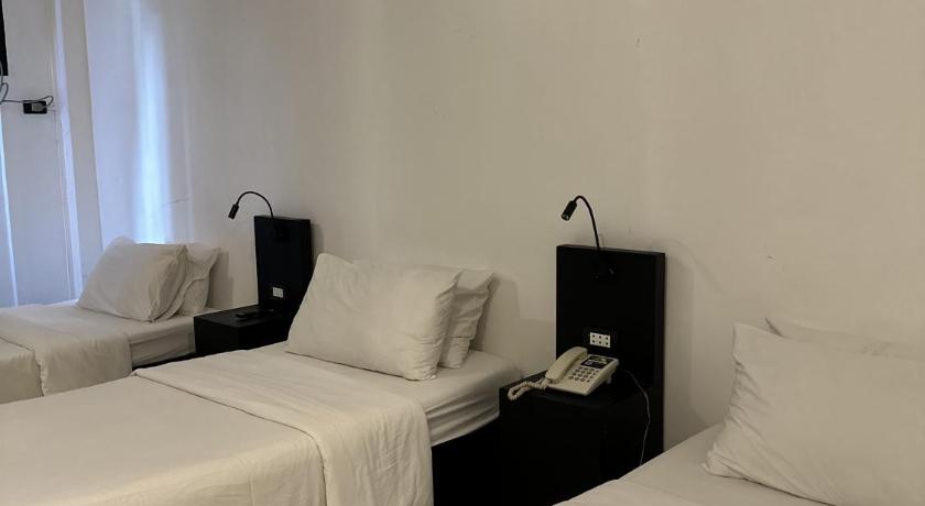 Image of Triple Room with Private Bathroom 9