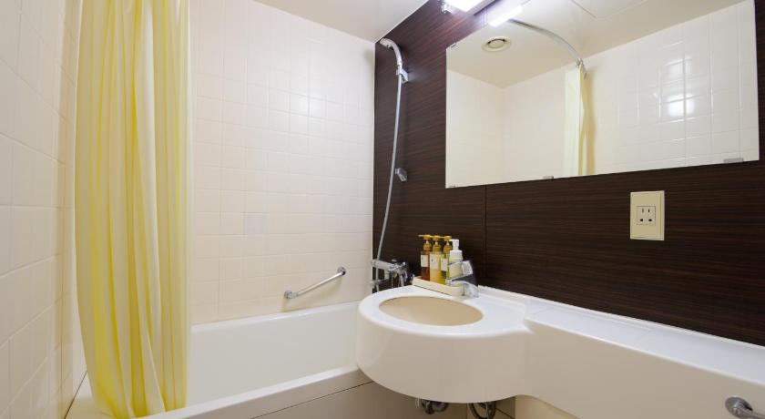 a bathroom with a sink, toilet and bathtub, Chisun Hotel Utsunomiya in Utsunomiya