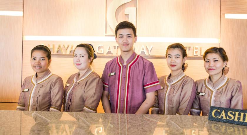 three women are posing for a picture in front of a counter, Phayao Gateway Hotel (SHA Extra Plus) in Phayao