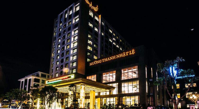 a large building with a clock on the side of it, Muong Thanh Luxury Nhat Le Hotel in Đồng Hới (Quảng Bình)