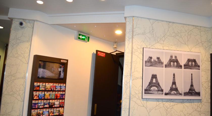 a wall with a picture of a man on it, Migny Opera Montmartre Hotel in Paris