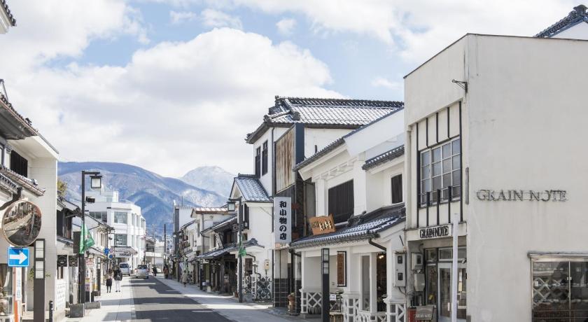 a city street filled with lots of buildings, Premier Hotel Cabin Matsumoto in Matsumoto