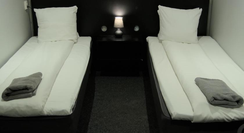 Bild av Tvåbäddsrum med delat badrum - Inget fönster (Twin Room with Shared Bathroom - No Window) 2