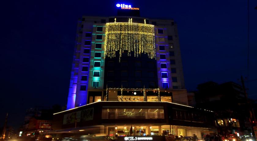 a large building with a clock on the top of it, Hotel Olive Downtown in Kochi
