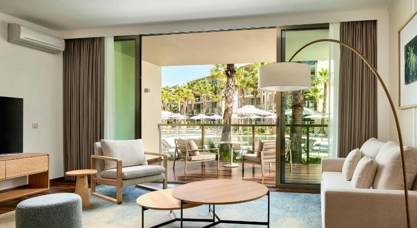 Image of One-Bedroom King Suite with Balcony and Pool View 0