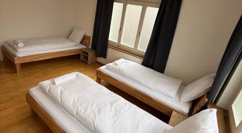 Image of Basic Triple Room with Shared Bathroom 3