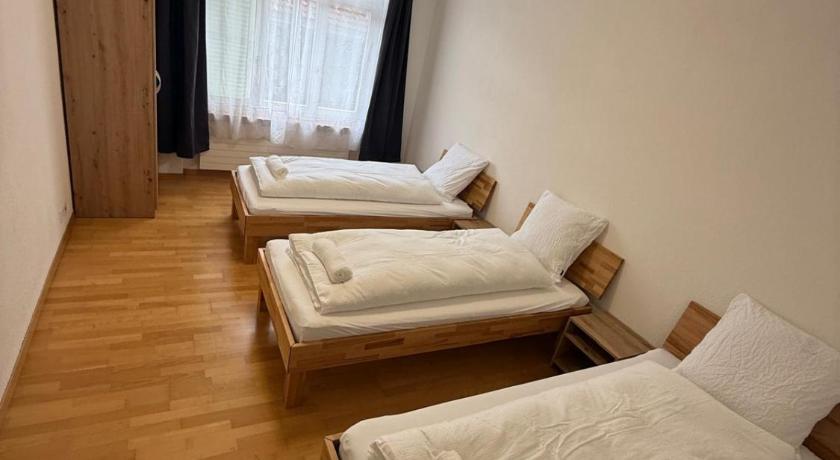 Image of Basic Triple Room with Shared Bathroom 0