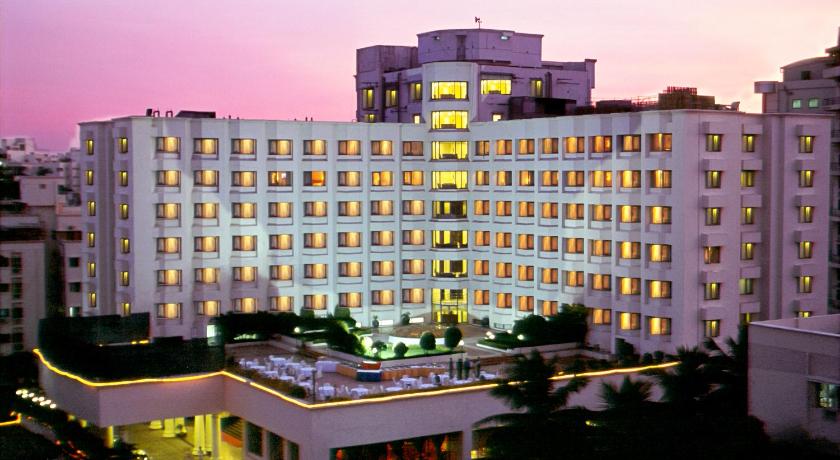 a large building with a large clock on the side of it, Katriya Hotel & Towers in Hyderabad