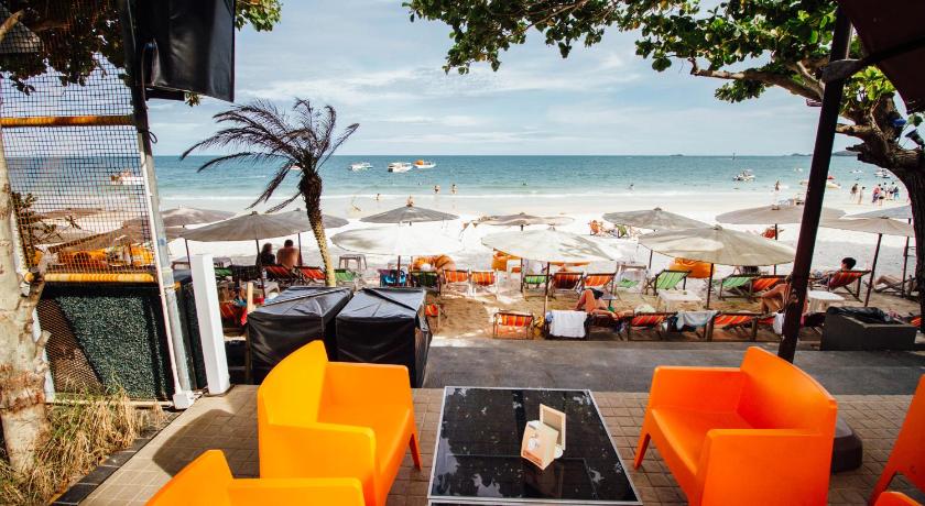 a patio area with tables, chairs and umbrellas, Samed Grandview Resort in Ko Samet