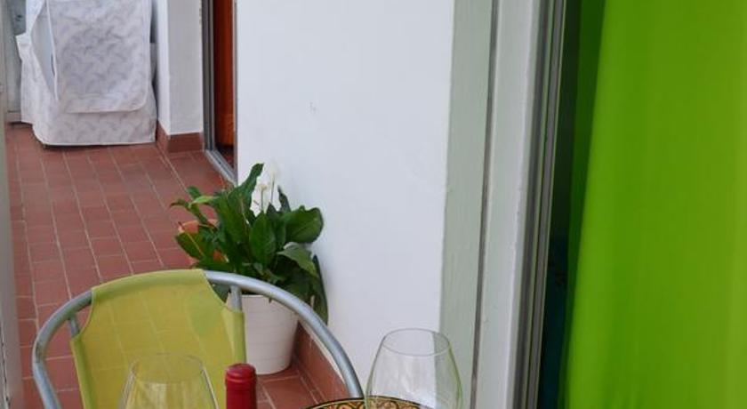 a bottle of wine sitting on a table next to a bottle of water, Axarquia Apartments in Nerja