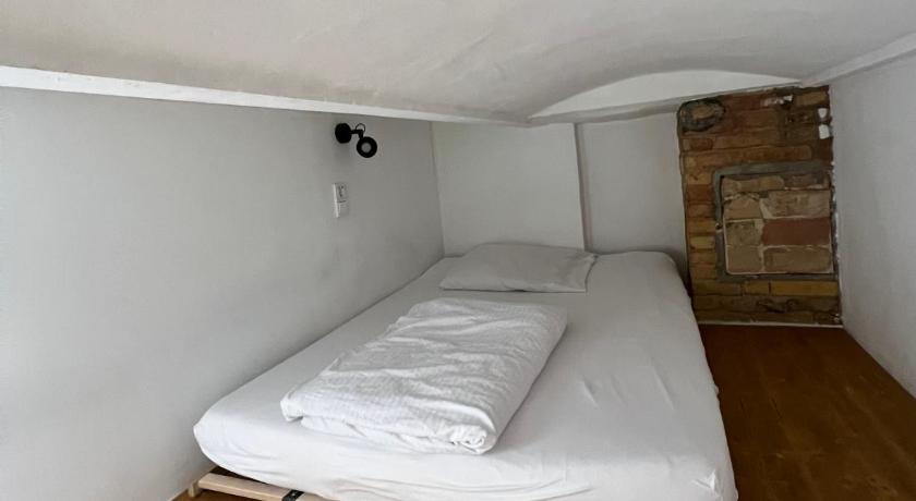 Image of Economy Triple Room with Shared Bathroom 1