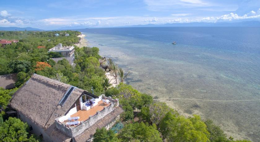a house on a hill overlooking the ocean, The Blue Orchid Resort in Cebu