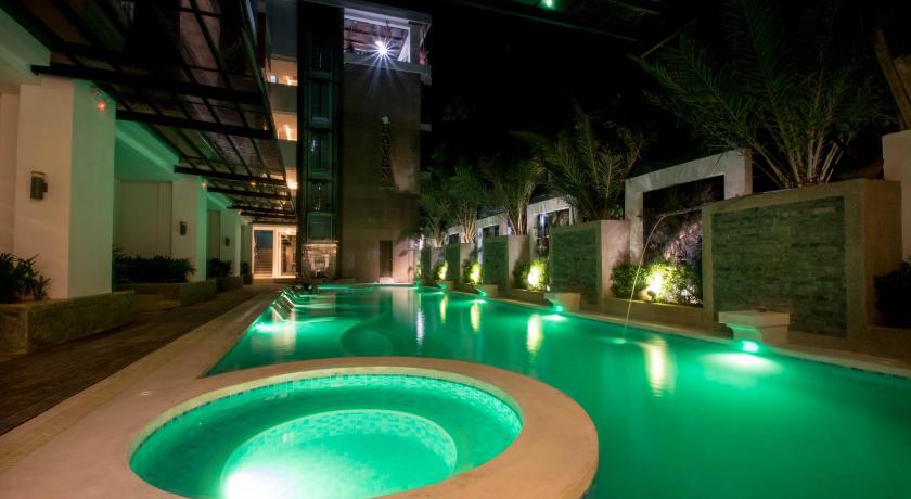 a large swimming pool with a large fountain, Boracay Haven Suites in Boracay Island