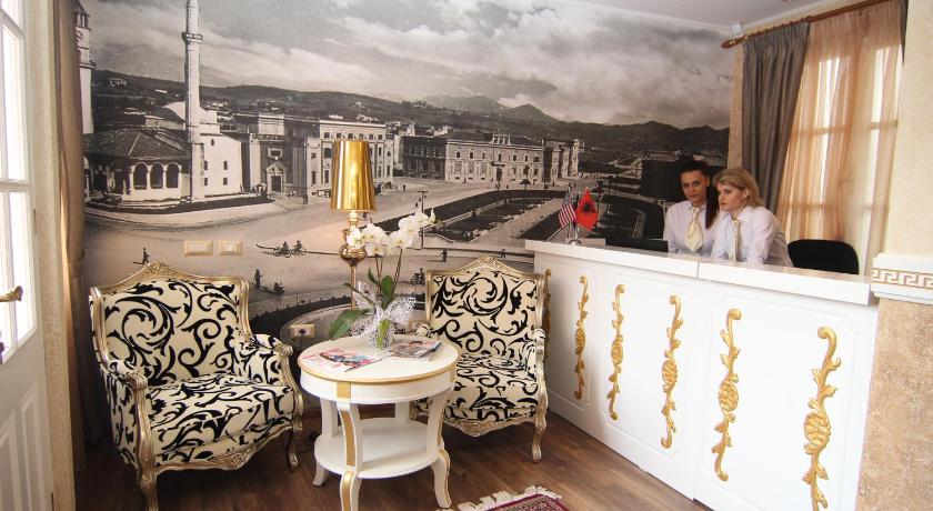people sitting on a balcony overlooking a city, Hotel Boutique Restaurant Gloria in Tirana