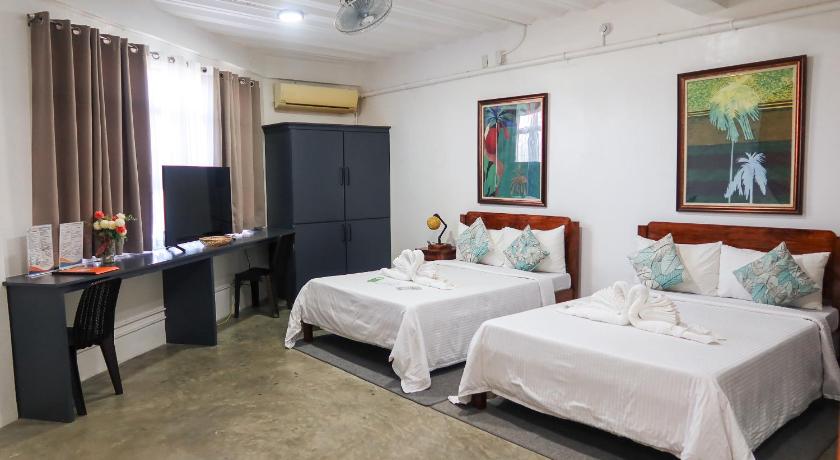 Image of Deluxe Queen Room with Two Queen Beds 0