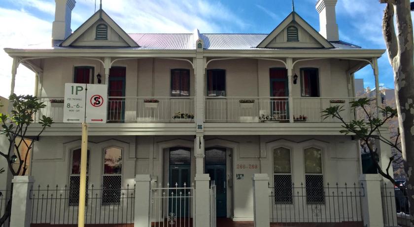 a white and red building with two windows, Hay Street Traveller's Inn in Perth