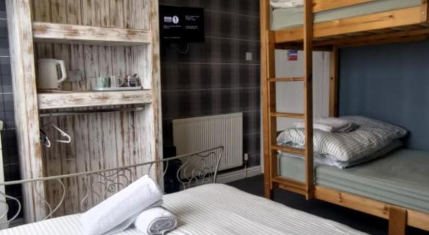 Image of Quadruple Room with Shared Bathroom 0