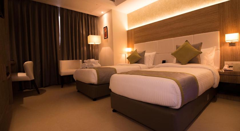 Image of Deluxe Double Room (2 Adults + 1 Child) 1