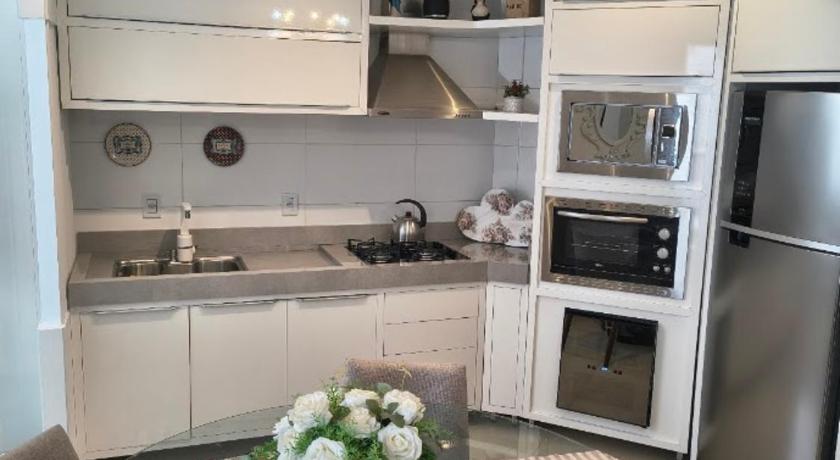 Apartamento aconchegante com ar, secadora e adega