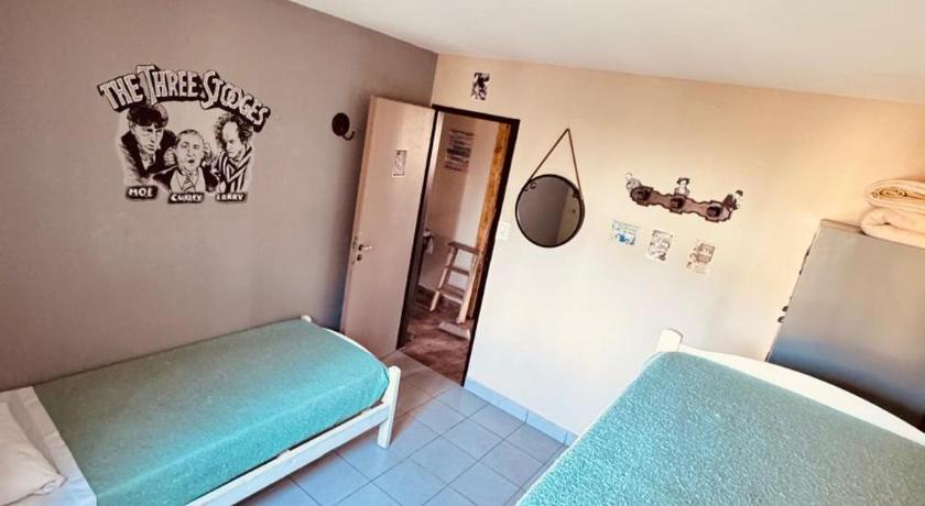 Image of Basic Triple Room with Shared Bathroom 4