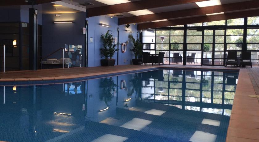 a large swimming pool in a hotel room, Novotel Canberra in Canberra