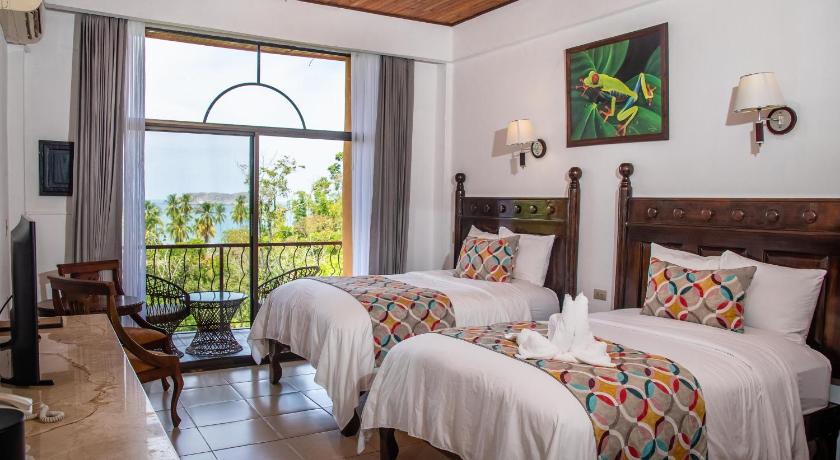 Image of Deluxe Room with Partial Ocean View Two Beds 0