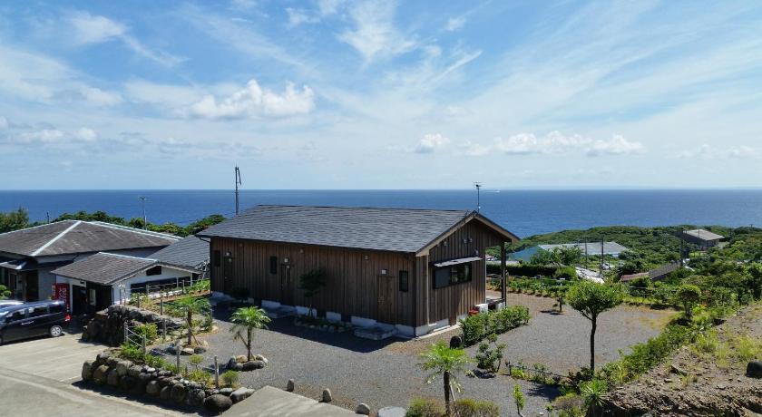 a large building with a view of the ocean, Minnsyuku Yakushimaya in Yakushima